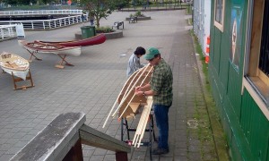 Father and son building a boat